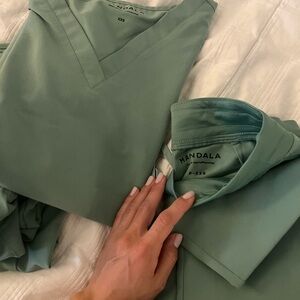 Two pairs of mandala scrubs. Top and bottom. Green. Can see sizes in photo.